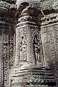 Ta Prohm temple - devatas sculpted on the gallery walls